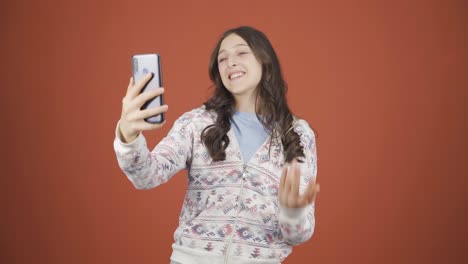 Young-woman-making-a-video-call-on-the-phone.